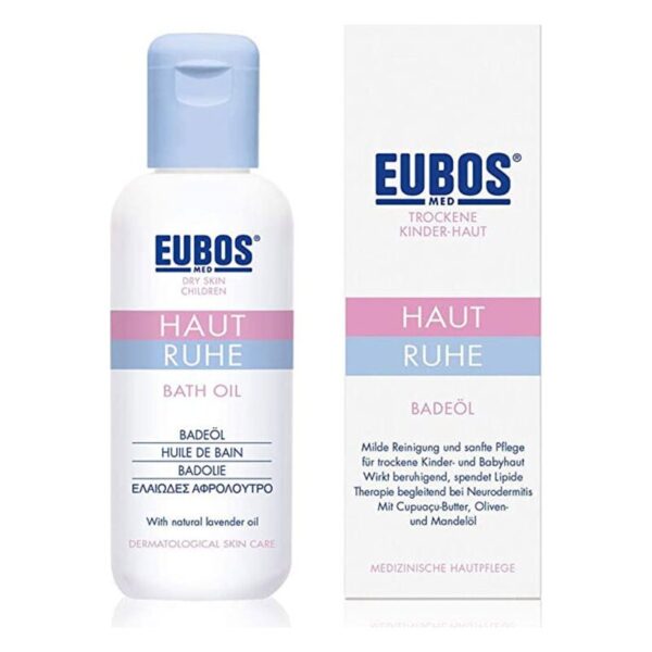 Badeöl für trockene Kinderhaut in einer weißen Flasche mit blauer Kappe und einem farblich passenden Karton.