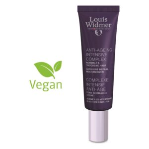 Röhrenförmige Verpackung des Louis Widmer Anti-Ageing Intensive Complex in lila, beschriftet mit veganem Symbol.