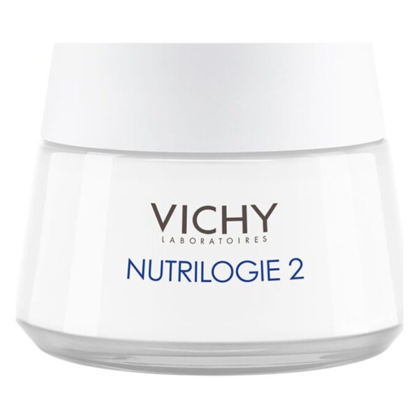 Eine weiße Cremedose mit einem klaren Deckel, beschriftet mit "VICHY NUTRILOGIE 2".