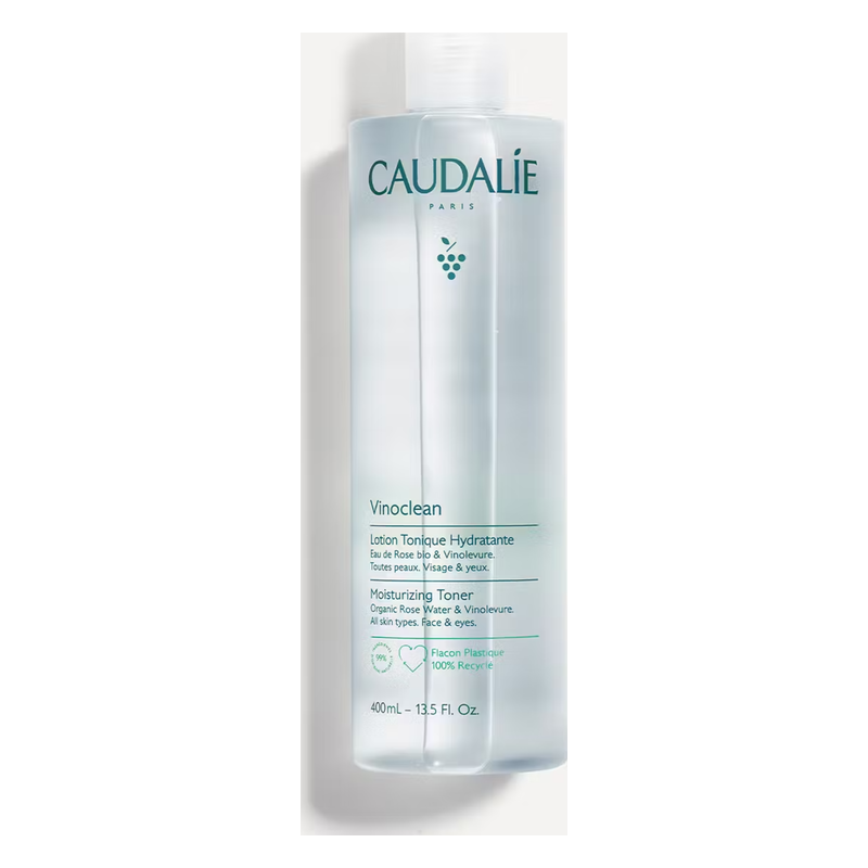 Flasche hydratierender Gesichtswasser von Caudalie mit hellblauer Flüssigkeit und grünem Label.