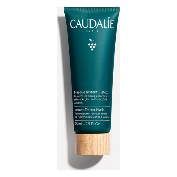 Grünes Tubenverpackung für eine Gesichtsmaske von Caudalie, beschriftet mit "Masque Instant Détox" und Inhaltsstoffen.