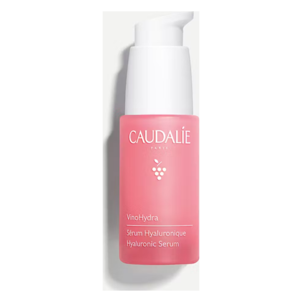 Hyaluronserum in einem pinken Pumpspender mit weißem Deckel, Etikett in mehreren Sprachen.