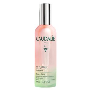 Flasche mit Eau de Beauté von Caudalie, halbtransparent in Pink und Grün, mit silberner Kappe, Inhalt 100ml.