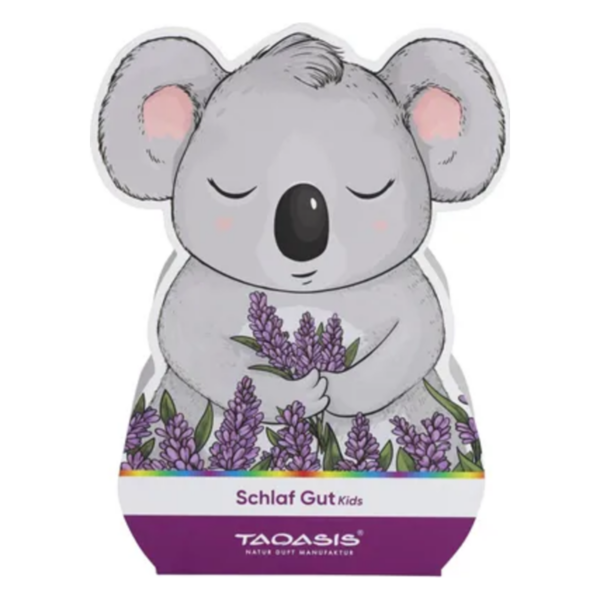 Koala-Figur mit geschlossenen Augen, umgeben von Lavendelblüten, in einer bunten Verpackung.